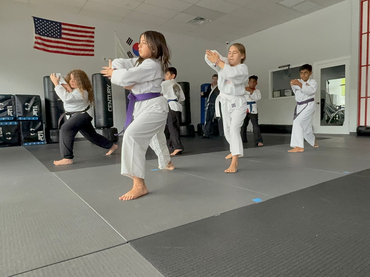 Empower Martial Arts demo team kicking demonstration