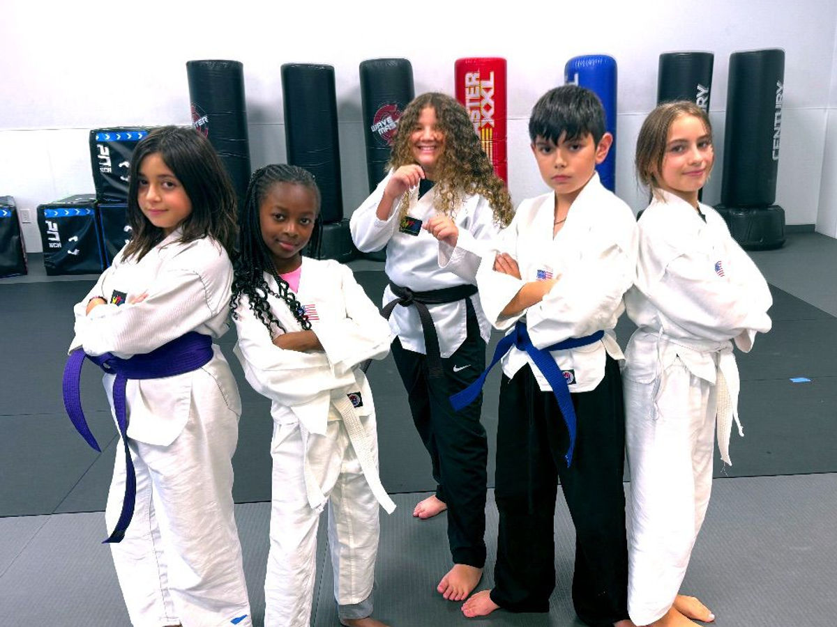 Empower Martial Arts demo team group photo 2025